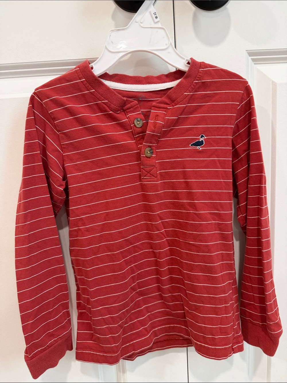 Properly tied little boys long sleeve shirt